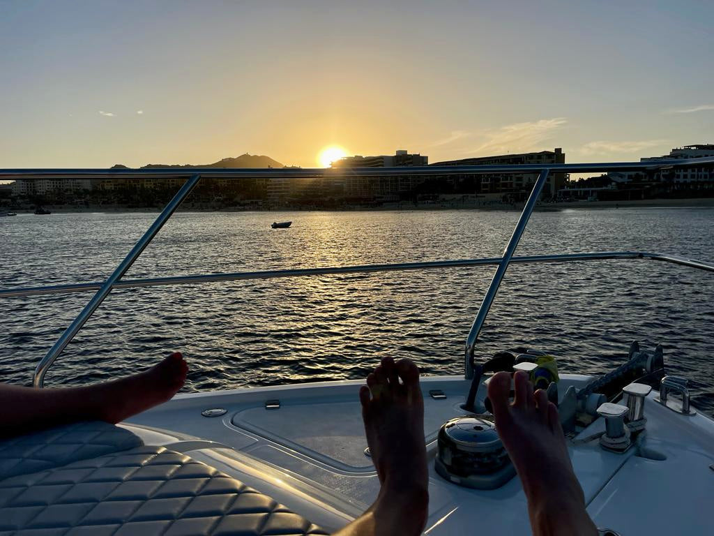 A couple on the bow of a luxury yacht during a private yacht charter in Cabo San Lucas with Best Cabo Yachts