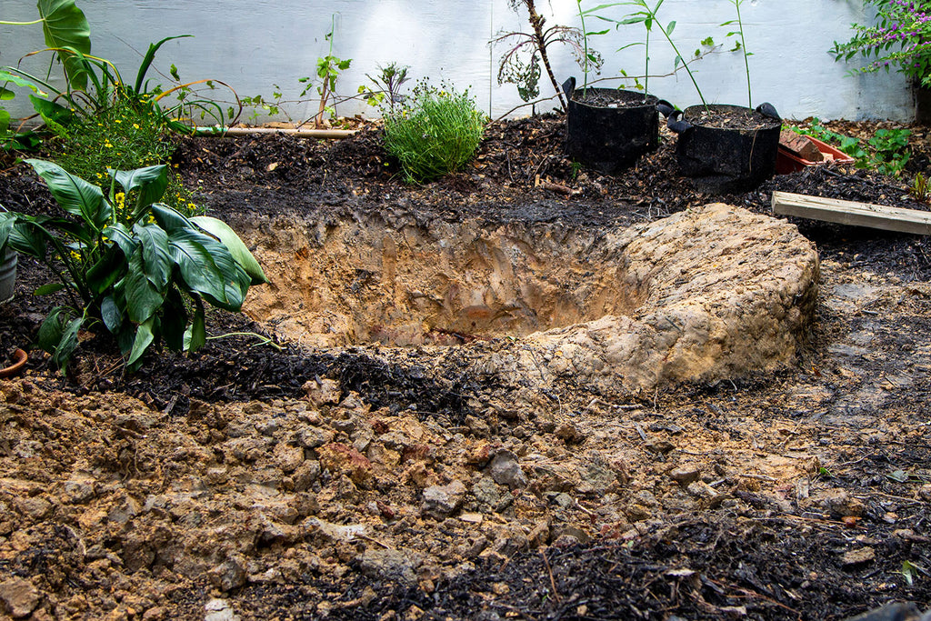 Another angle of the gentle sloped area where a retaining wall will need to be built to keep the dirt in place.