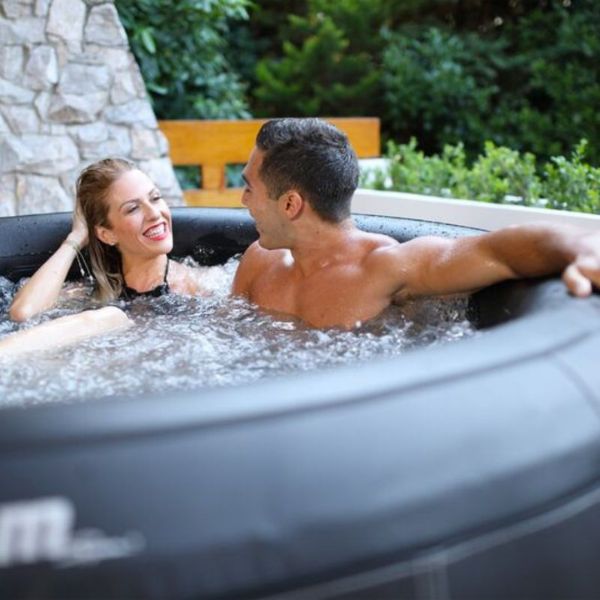 MSpa Camaro Backyard Spa with Couple Sharing a Romantic Moment Inside