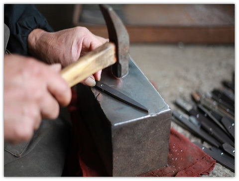 handmade hair shears leveling the blade