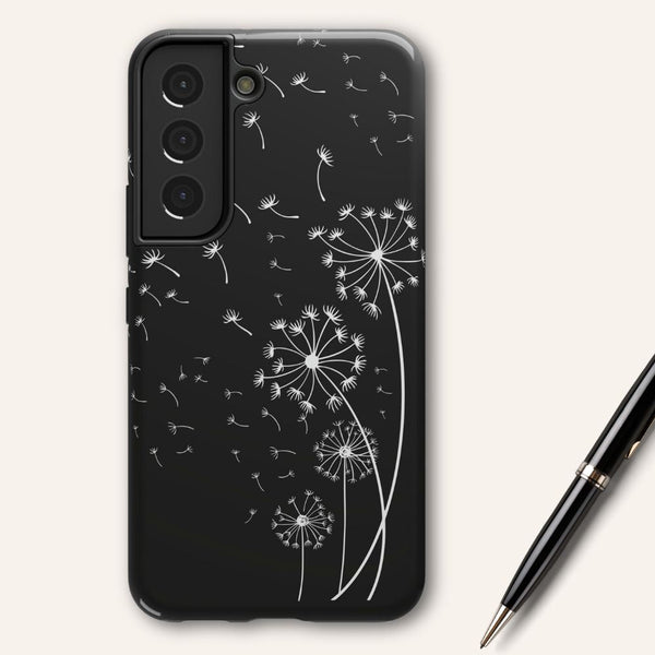 Black phone case with white line graphic of dandelions