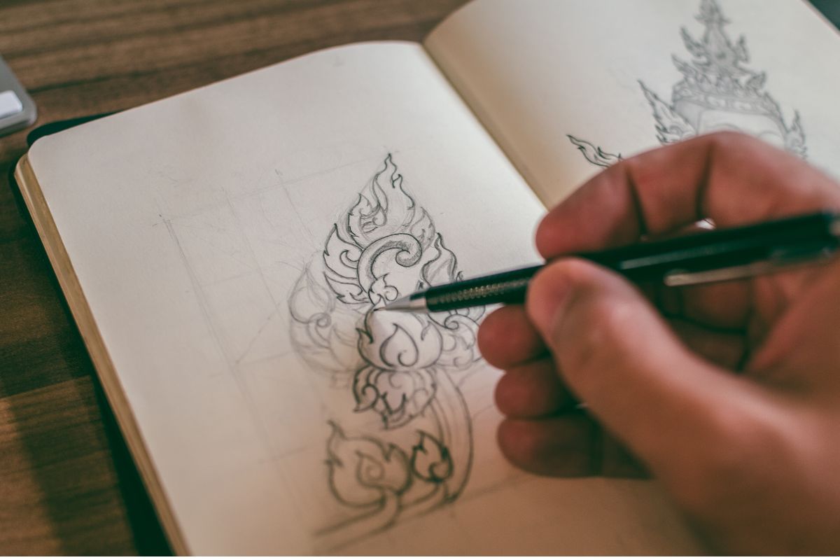 sketching in a notebook for The Artist's Way