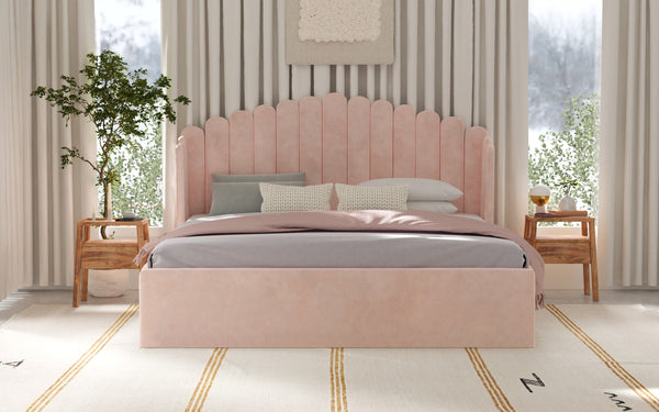 Elegant pink velvet bed with scalloped headboard in a serene bedroom, showcasing 2024 bed design trends