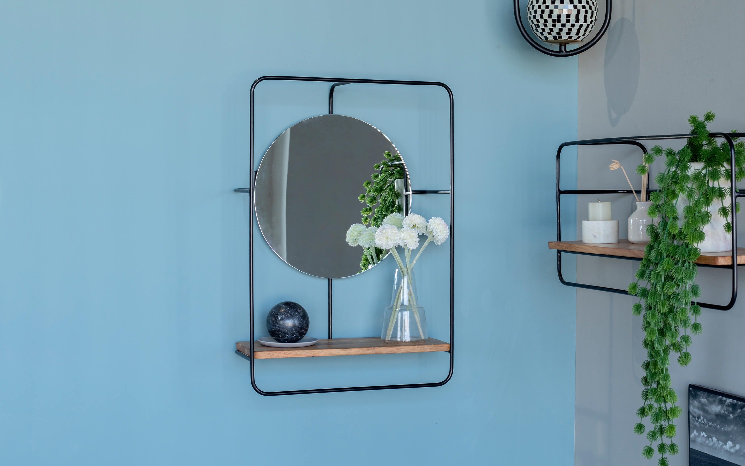 Wooden Shelf with Attached Mirror on the wall of the bedroom decor