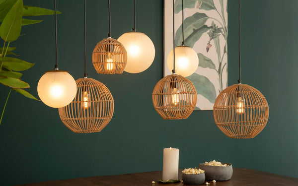 Cluster of modern hanging lamps featuring a linear arrangement, perfect for housewarming gifts to brighten up a dining area or kitchen island