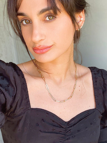girl wearing paperclip necklace