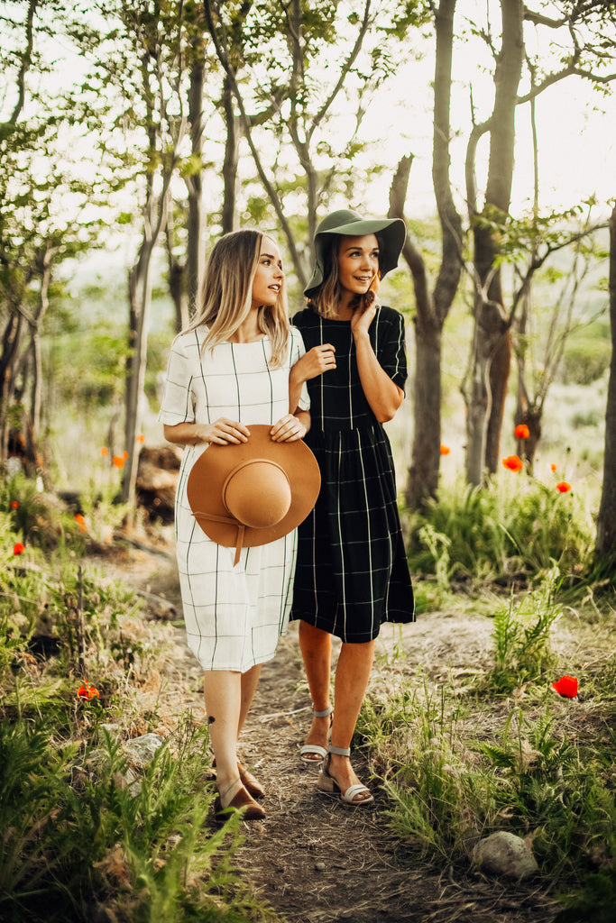 two piper & scoot models wearing dresses out in the poppy fields