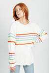 The Kipper Rainbow Striped Sweater in White, studio shoot; front view