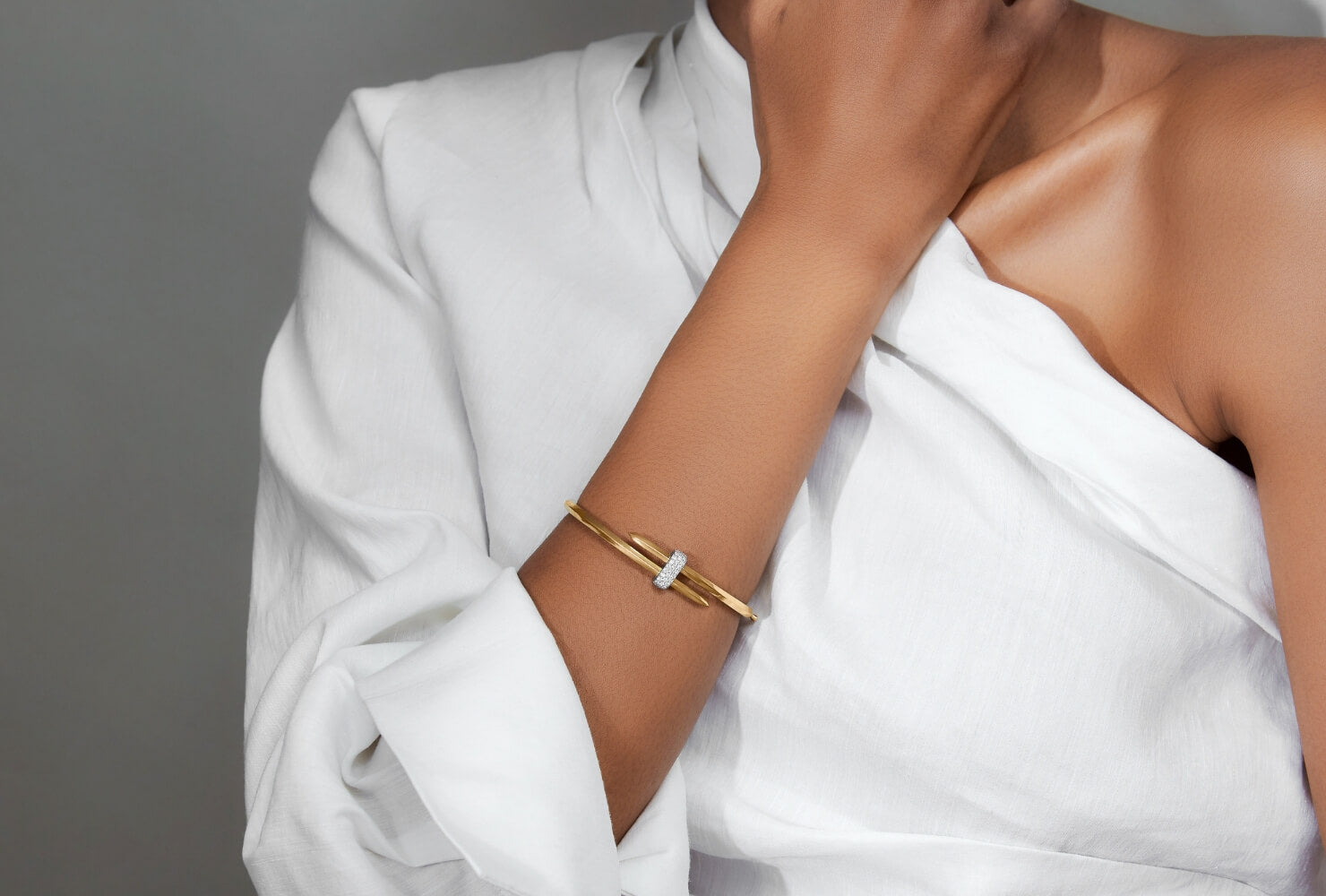 Model wearing Ecksand Duel Bangles