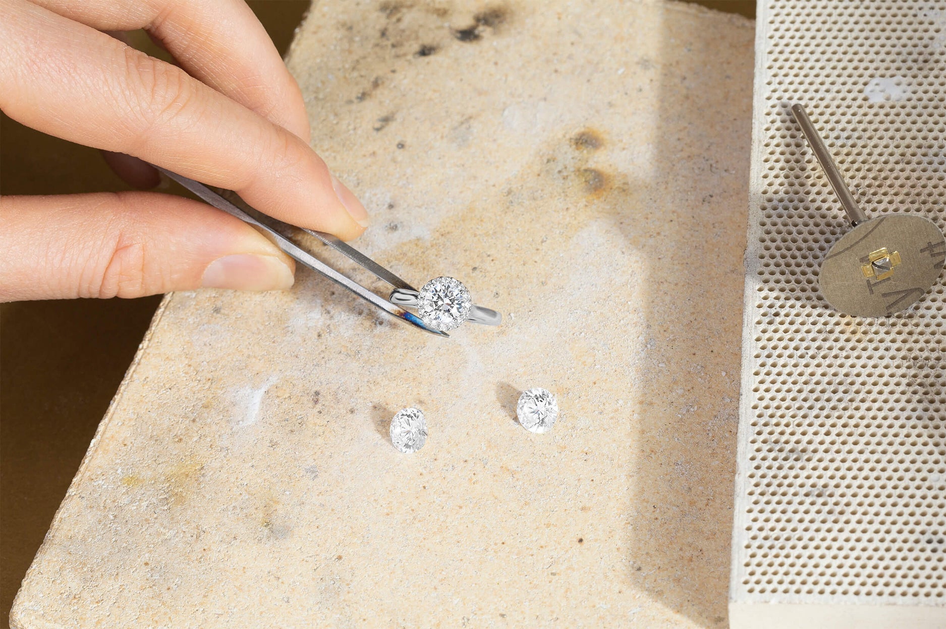 An image of three diamonds on a workbench 