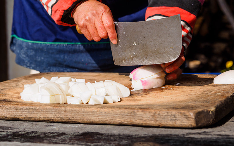 Versatility - Woman Cuts Vegetables with Chinese Cleaver Cai Dao