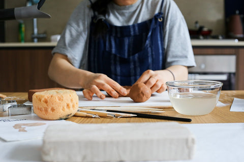 woman working on clay