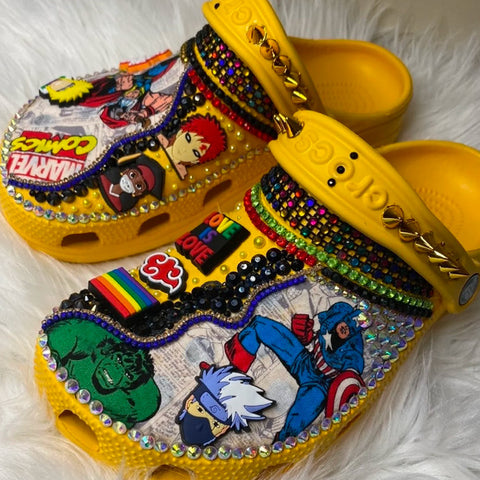Yellow paired of blinged out Crocs.