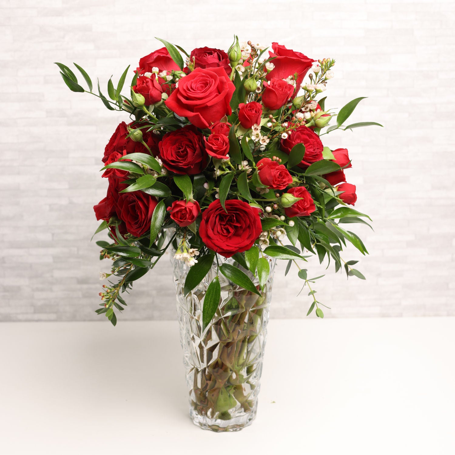 Fresh Red Roses in a Vase