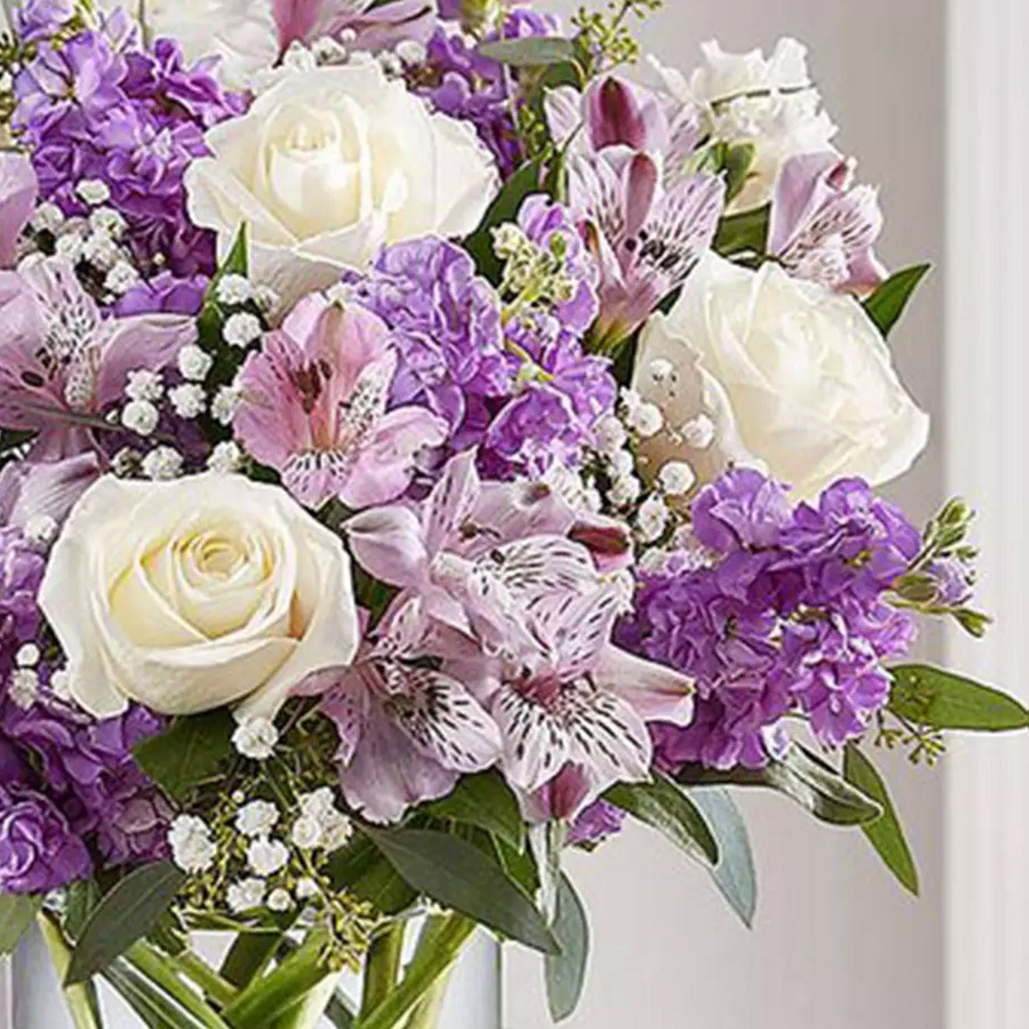 Purple and White Floral Bunch In Glass Vase