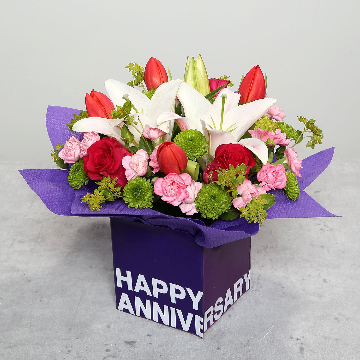 Tulips Roses And Carnations In Glass Vase