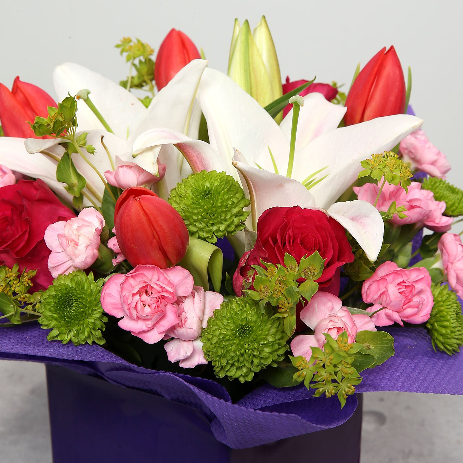 Tulips Roses And Carnations In Glass Vase