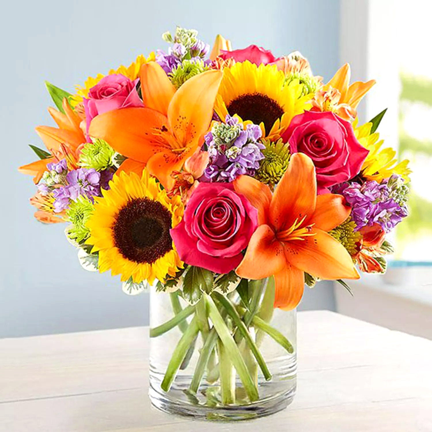 Vivid Bunch Of Flowers In Glass Vase