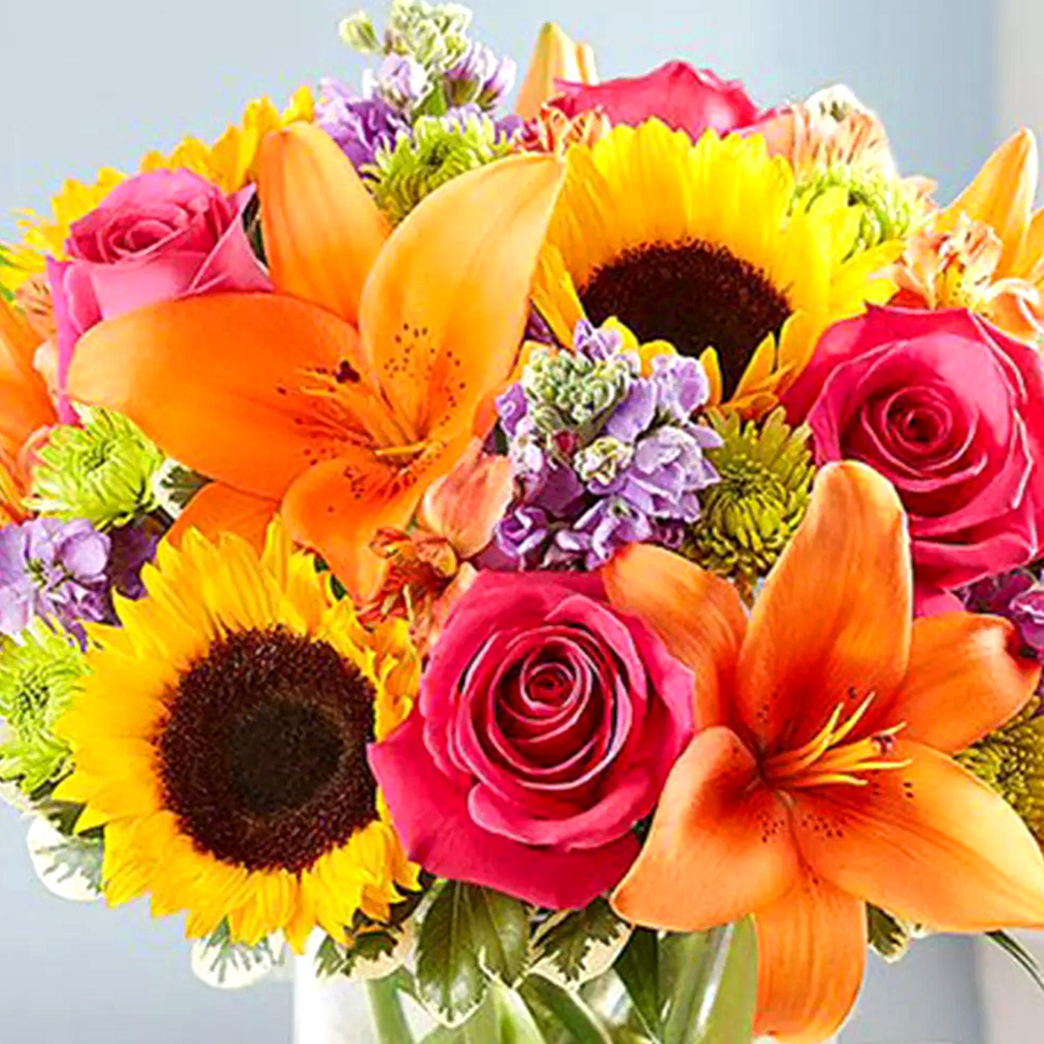 Vivid Bunch Of Flowers In Glass Vase