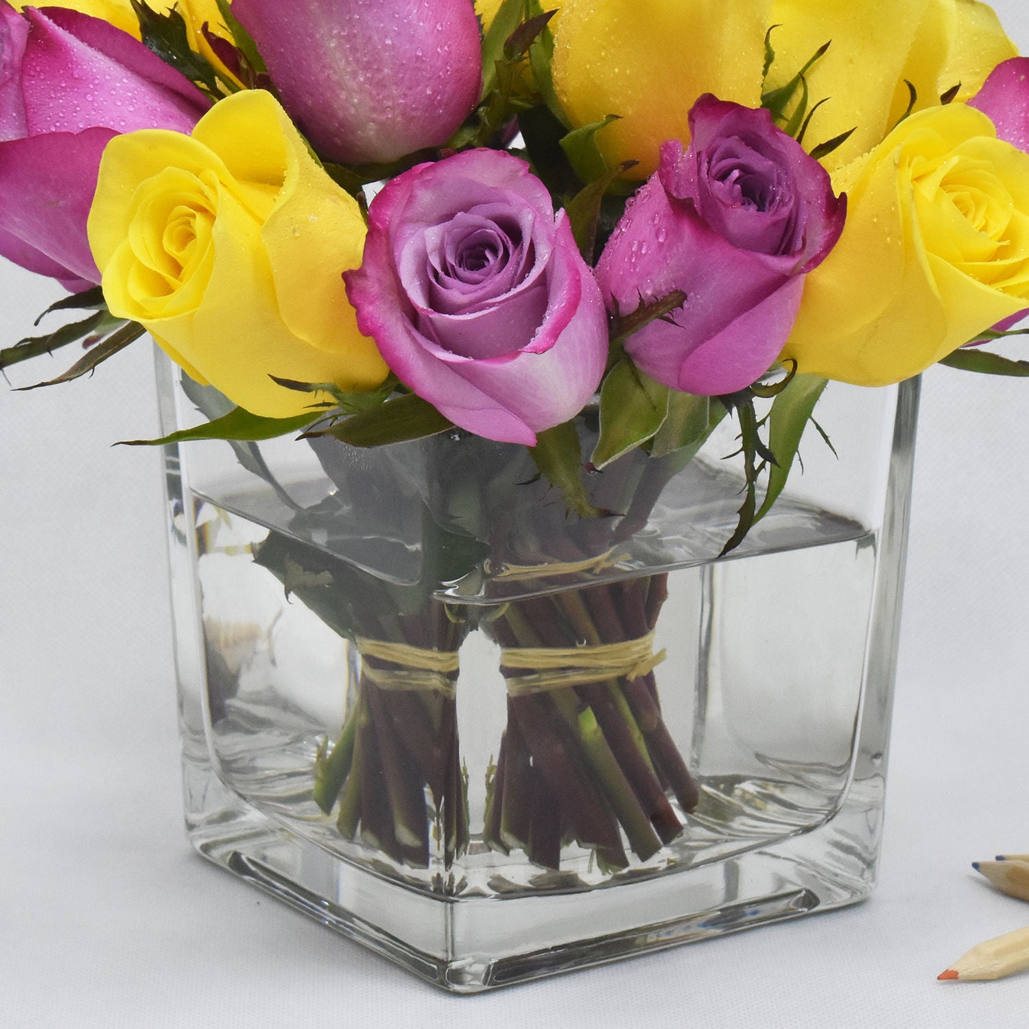 Yellow N Purple Roses In Vase