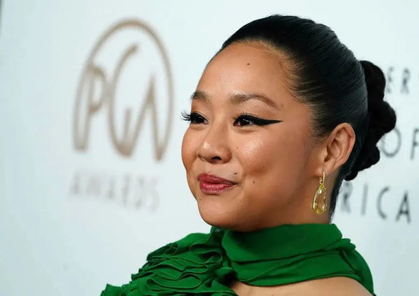 Stephanie Hsu at the PGA Awards in a floor-length green gown