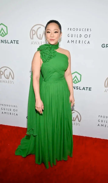 Stephanie Hsu in floor-length green gown at the PGA Awards red carpet