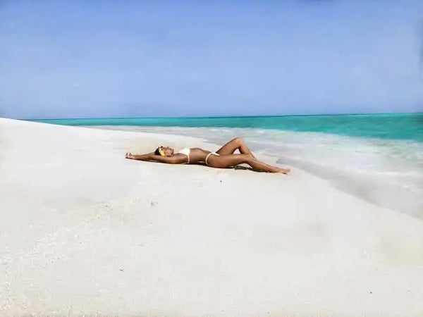 Woman lying down in Ibiza beach