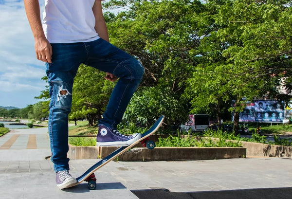 man skateboarding denim jeans