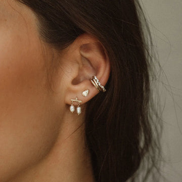 castanet pearl earring on body}