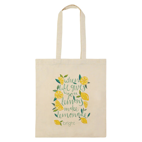 A branded tote bag with a lemon theme and quote printed on the front.