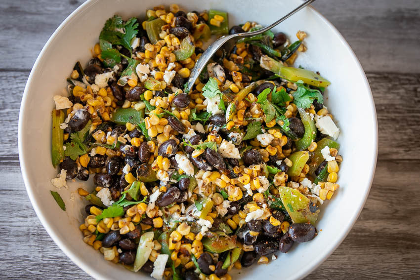 Bean, corn, and pepper salad in a serving bowl