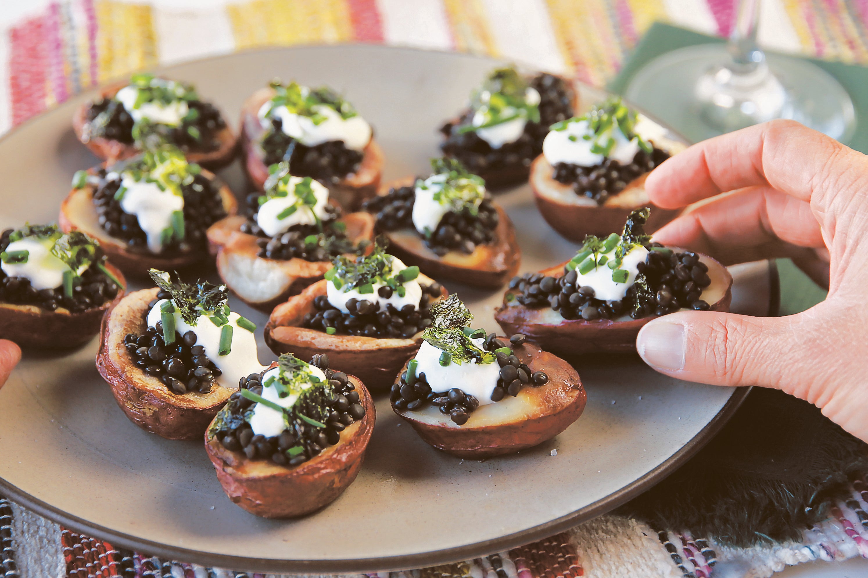 Small potatoes topped with Rancho Gordo black lentils and creme fraiche.