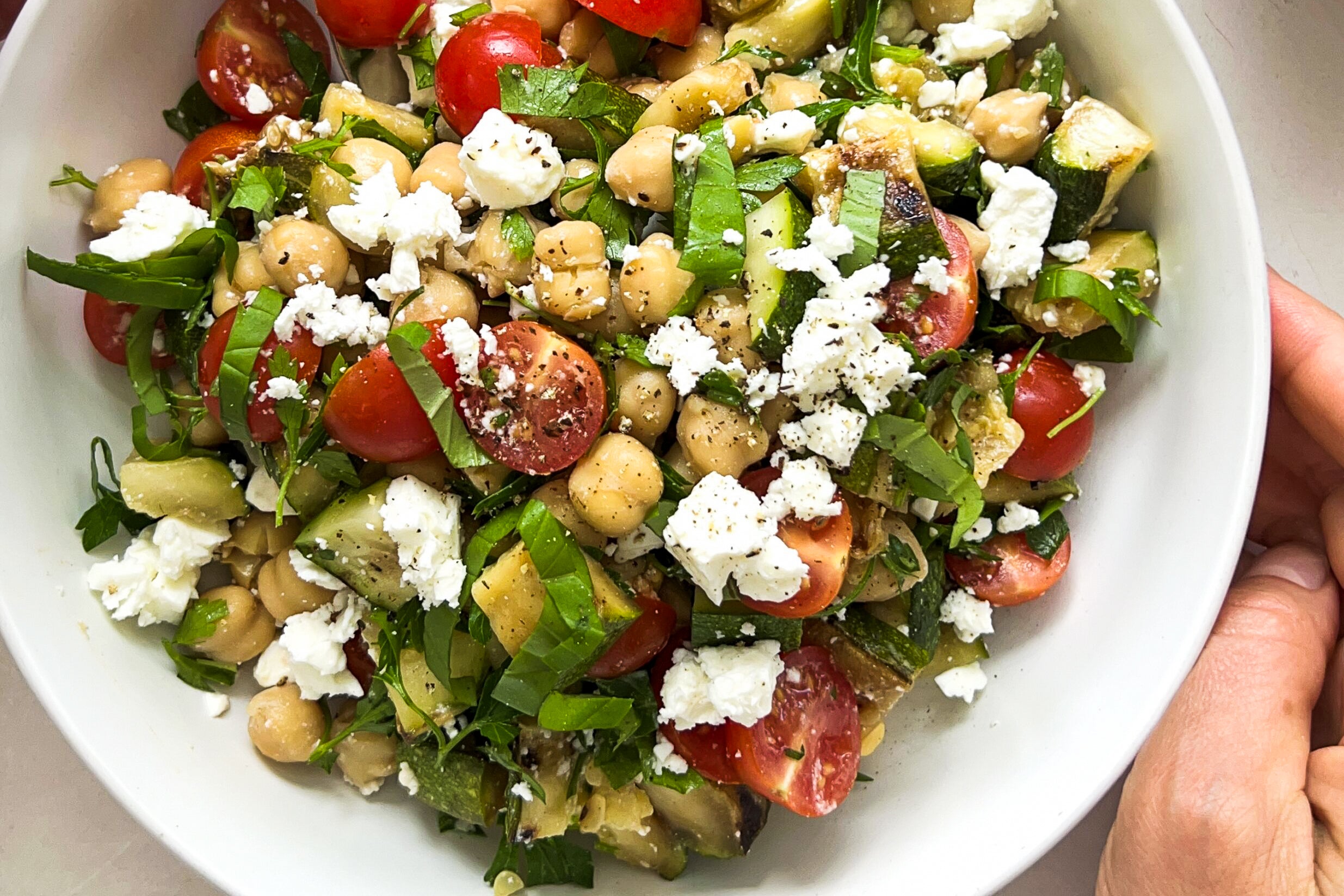 Zucchini and garbanzo salad in a serving bowl