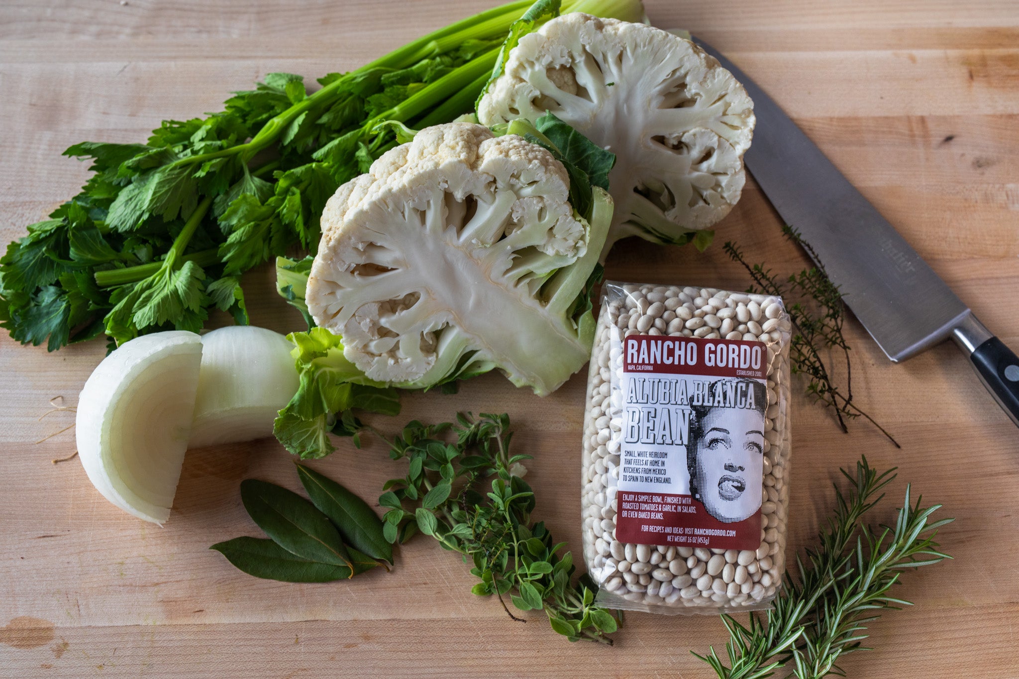 A bag of Alubia Blanca Bean with cauliflower, celery, onion, oregano, rosemary, bay leaf and thyme