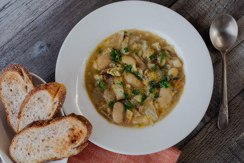 Charred Cabbage and Caramelized Shallot Soup with Royal Corona Beans with bread