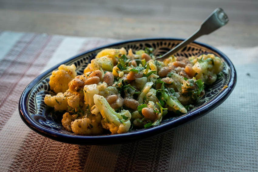 Steamed cauliflower with white beans and a lemon caper sauce