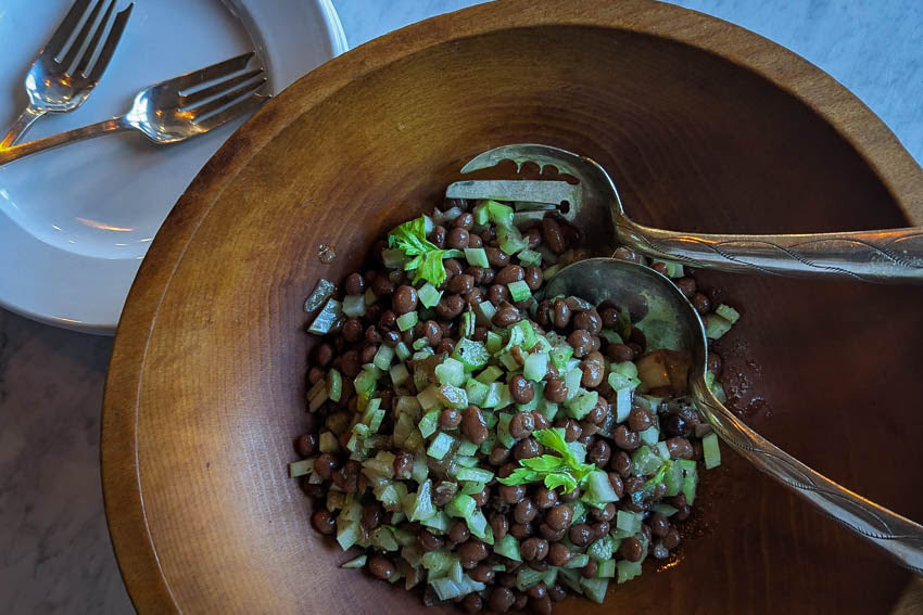 Pinquito bean salad with celery in a serving bowl