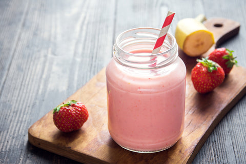 glass with strawberry banana smoothie