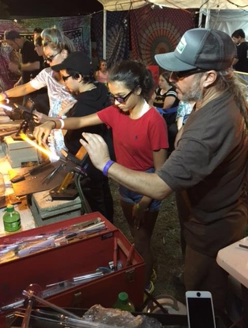 Pez showing students his art at the wormtown music festival