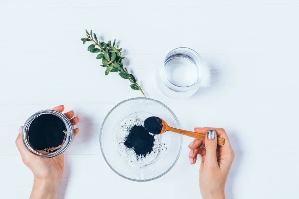 A bowl with charcoal powder paste