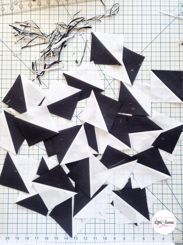 Image showing trimmed and pressed black and white half square triangles