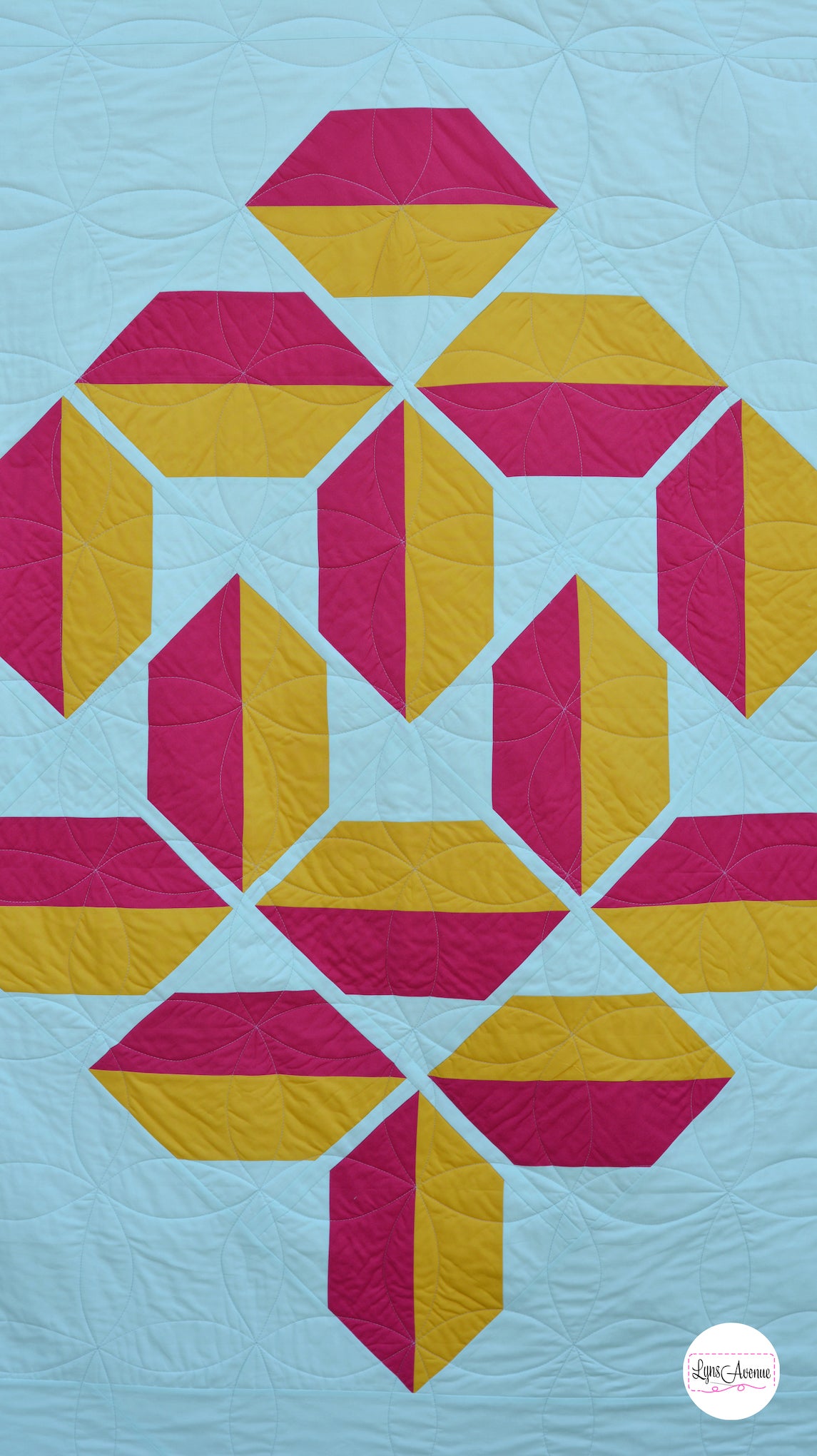 Red and Yellow flourishing quilt pattern on a mint background