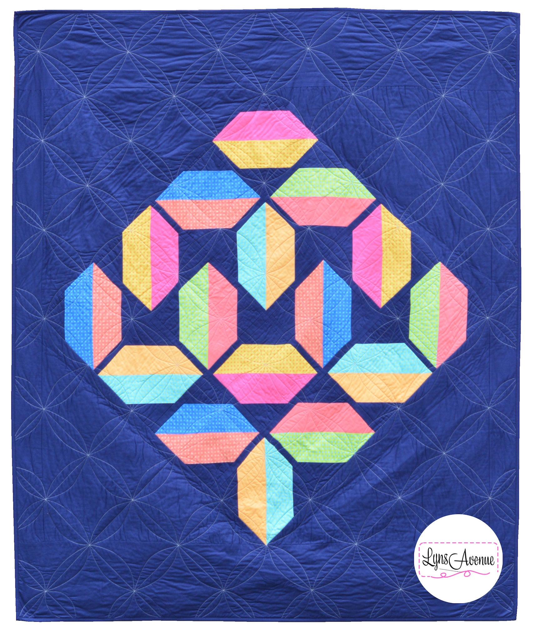 Flourishing Quilt pattern - a flower design quilt pattern in bright pink, yellow, blue and peach colour on a navy blue background