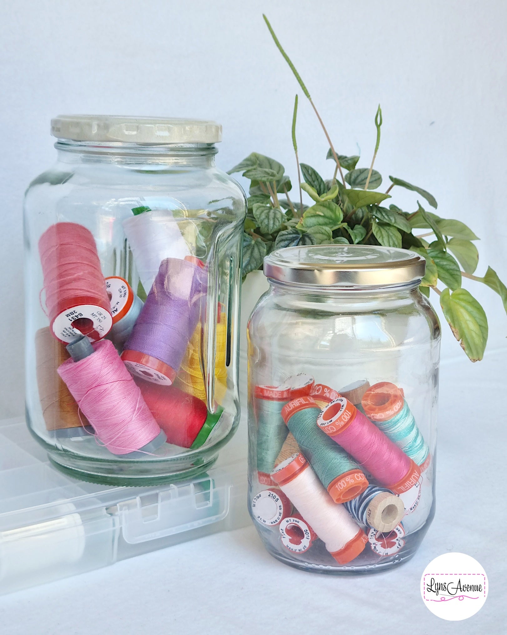 Aurifil threads in glass jars