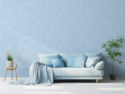 Cool and serene blue wallpaper in living room with cool blue sofa and green plants either side