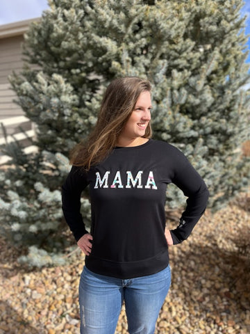 Woman wearing embroidered MAMA sweatshirt