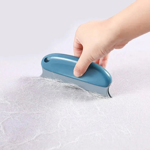 Brosse pour enlever efficacement les poils de chat sur les vêtements.