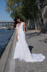 Vancouver Wedding Dress worn by bride in Paris while standing along the river.
