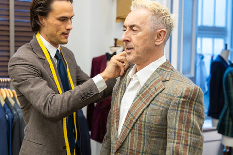 Alan Cuming is fitted for his bespoke coat