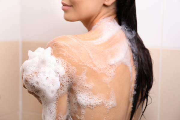 woman in a shower with soap